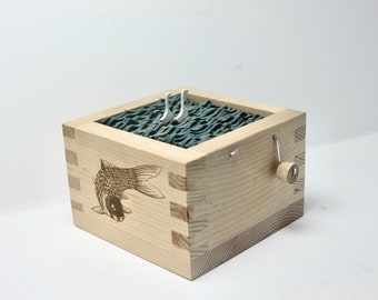 kinetic sculpture wood swans in koi fish sake box