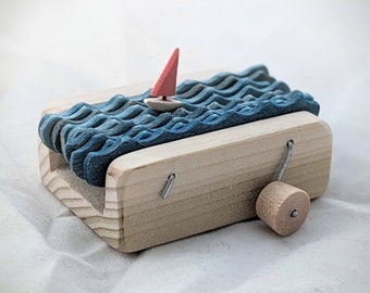 Wooden sailboat automaton sculpture