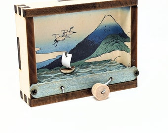 tiny kinetic sculpture Japanese woodblock sailboat Mt Fuji Hokusai