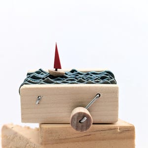 Kinetic sculpture nautical wooden sailboat automaton