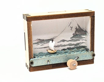 Japanese woodblock tiny kinetic sculpture paper sailboat Mt Fuji Hokusai