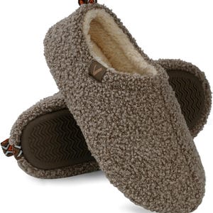 May include: A pair of brown fuzzy slippers with a brown rubber sole. The slippers have a white fleece lining.