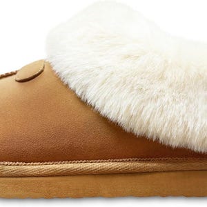 May include: Tan suede slippers with a white faux fur cuff. The slippers have a brown rubber sole.