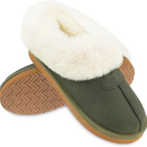 May include: Green suede slippers with a faux fur trim and a brown rubber sole.