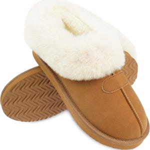May include: A pair of brown suede slippers with a white faux fur trim. The slippers have a brown rubber sole with a textured pattern.