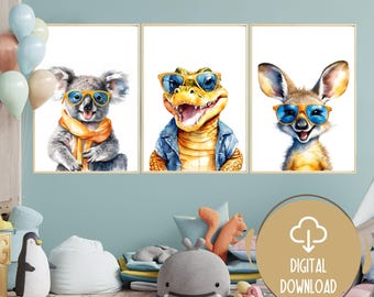 May include: Three watercolor illustrations of animals wearing sunglasses. A koala wearing a yellow scarf, a crocodile wearing a denim jacket, and a kangaroo.