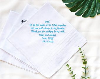 May include: White handkerchiefs with embroidered text. One handkerchief has the word "He" embroidered in black. Another has a message in teal that reads "Dad, Of all the walks we've taken together, this one will always be my favorite. Thank you for walking by my side, today and always. Love, Nikki 10.11.2025."