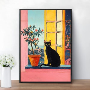 May include: A black cat with yellow eyes sits on a windowsill, looking out at a view of a city. A potted plant with pink flowers is on the windowsill to the left of the cat. The window is open and has yellow and white panes. The wall behind the windowsill is pink.