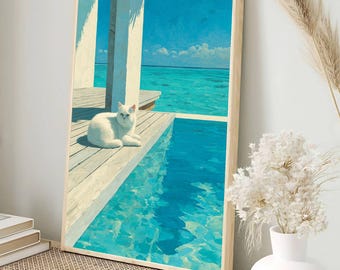May include: A framed art print showing a white cat resting by a turquoise pool, with a view of the ocean. The artwork has a light wood frame and a calm, sunny scene with a clear blue sky.