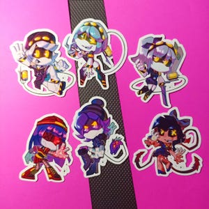 May include: Six colorful cartoon character stickers with different poses and expressions. The stickers are printed on white paper with a glossy finish.