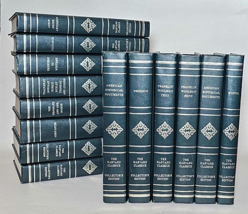 May include: A collection of The Harvard Classics, Collector's Edition books. The books have dark blue covers with silver lettering and decorative diamond patterns. Titles include "American Historical Documents" and "Emerson."
