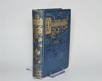 May include: A blue hardback book titled Dryden's Poems with gold embossed floral patterns on the front cover and spine. The spine features the text Dryden's Poems and the front cover displays the name Dryden with a decorative letter D.