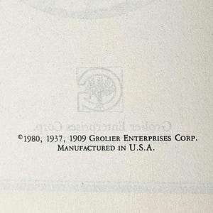 May include: Cream-colored paper with the Grolier Enterprises Corp. logo and copyright information. The text includes the years 1980, 1937, and 1909, along with "Manufactured in U.S.A."
