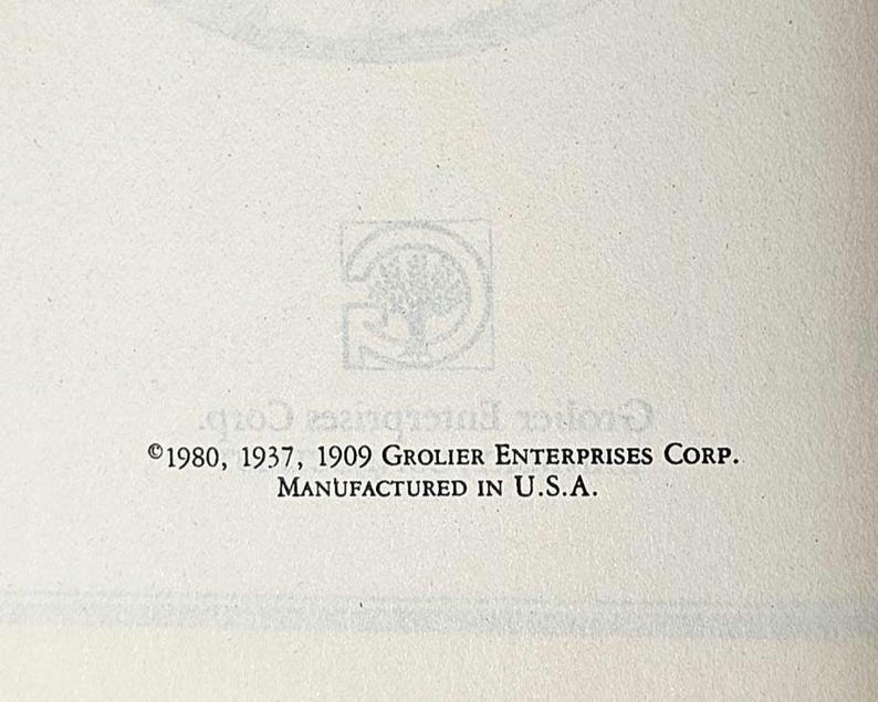 May include: Cream-colored paper with the Grolier Enterprises Corp. logo and copyright information. The text includes the years 1980, 1937, and 1909, along with "Manufactured in U.S.A."