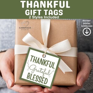 May include: A wrapped gift with a white ribbon and a green and white gift tag that reads "THANKFUL, Grateful, BLESSED". The gift tag is attached with twine. The image also includes the text "THANKFUL GIFT TAGS, 2 Styles Included, INSTANT DIGITAL DOWNLOAD".