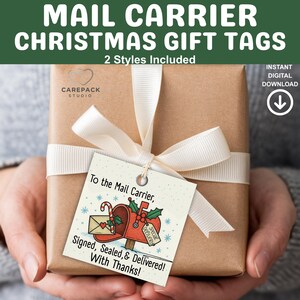 May include: A wrapped gift with a cream ribbon and a gift tag that reads "To the Mail Carrier, Signed, Sealed, & Delivered! With Thanks!". The tag features a mailbox illustration with Christmas elements. The text "MAIL CARRIER CHRISTMAS GIFT TAGS" is at the top.