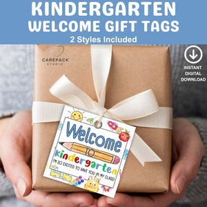 May include: A wrapped gift with a white ribbon and a colorful "Welcome to Kindergarten" gift tag. The tag includes a pencil, a sun, and the text "I'm so excited to have you in my class!"