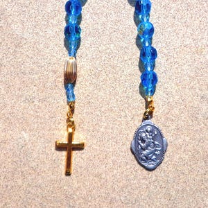 Saint Christopher, gold tone cross, blue glass beads, medal