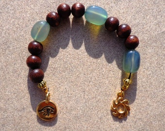 meditation beads, wood, green agate, Eye of Horus, sun charm