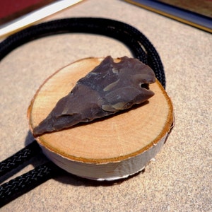 bolo tie, knapped brown stone arrowhead on birch wood disk