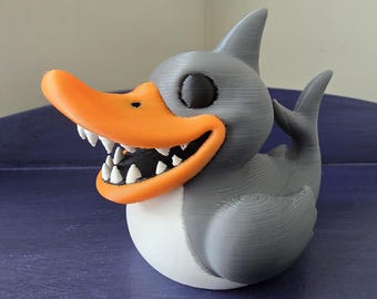 Angstaanjagende haaientandeend – Dash Buddy, ook bekend als Shuck, 3 inch hoog