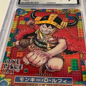 May include: A graded trading card featuring Monkey D. Luffy from One Piece. The card has a colorful background and depicts Luffy in a dynamic pose. The card is graded a 9 by CGC and includes Japanese text.