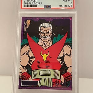 May include: A graded trading card featuring a comic book character. The card is from the 2024 Infinity Trilogy series, labeled "Stranger" and "Purple Boxes." The character is depicted in a red and green costume with a white mustache.