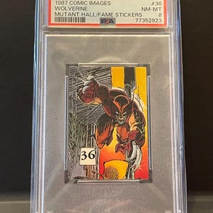 May include: A graded 1987 Comic Images Wolverine Mutant Hall/Fame sticker. The card features a dynamic illustration of Wolverine in action, with a cityscape background. The card is encased in a protective holder.