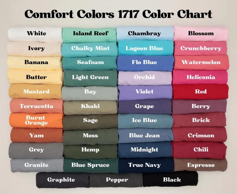 May include: A color chart displaying a variety of Comfort Colors 1717 fabric swatches. The chart features a range of colors, including white, ivory, banana, butter, mustard, terracotta, burnt orange, yam, grey, granite, island reef, chalky mint, seafoam, light green, bay, khaki, sage, moss, hemp, blue spruce, chambray, lagoon blue, flo blue, orchid, violet, grape, ice blue, blue jean, midnight, true navy, blossom, crunchberry, watermelon, heliconia, red, berry, brick, crimson, chili, espresso, graphite, pepper, and black.