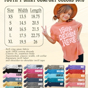 May include: A coral youth t-shirt with the text "YOUR DESIGN HERE". The image includes a size chart with measurements in inches and a color palette with various options. The shirt is made of soft ring-spun fabric.