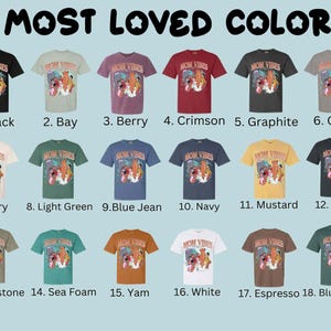 May include: A chart showing 18 different color t-shirts with the text "MOM VIBES" printed on each shirt. The colors are: black, bay, berry, crimson, graphite, grey, ivory, light green, blue jean, navy, mustard, pepper, sandstone, sea foam, yam, white, espresso, and blue spruce.
