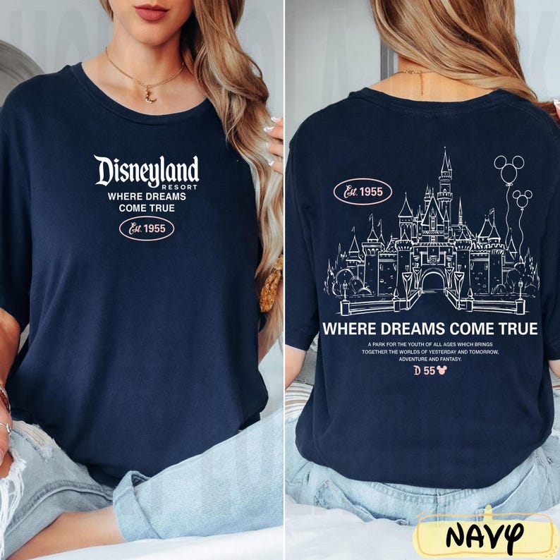 May include: Navy blue t-shirt with white Disneyland Resort text and the phrase "Where Dreams Come True." The back features a castle graphic and the text "Where Dreams Come True" with "Est. 1955."