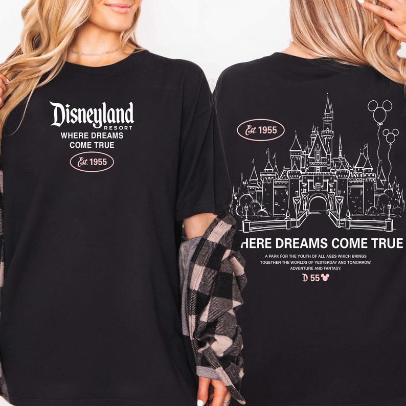 May include: Black t-shirt featuring the Disneyland Resort logo and the text "WHERE DREAMS COME TRUE" with "Est. 1955". The back of the shirt displays a castle graphic and the words "HERE DREAMS COME TRUE".