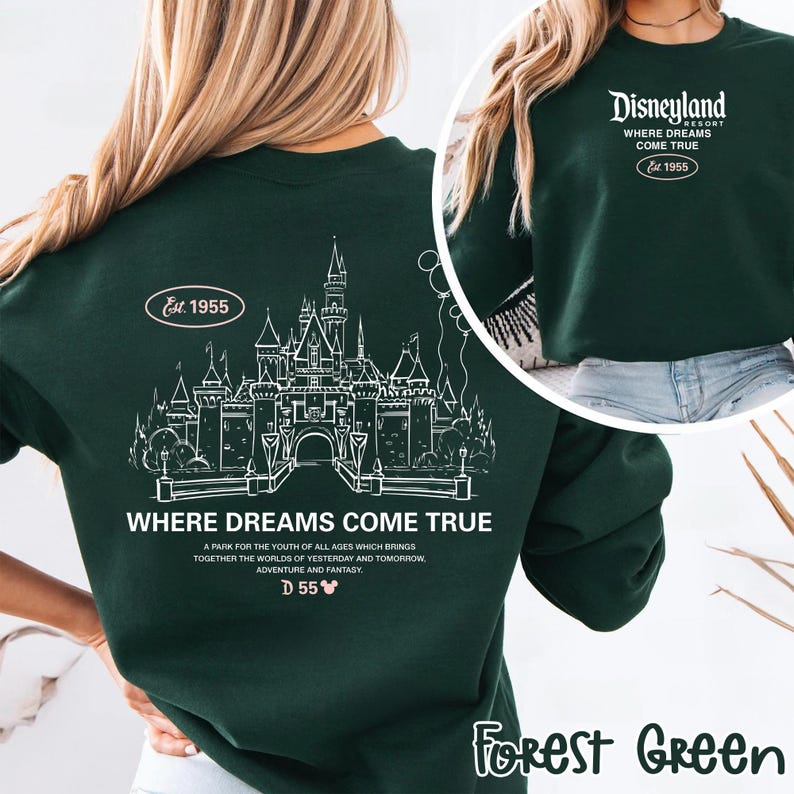 May include: Forest green sweatshirt with a white graphic of a castle and the text "WHERE DREAMS COME TRUE". The sweatshirt also features the text "Disneyland Resort Where Dreams Come True Est. 1955".