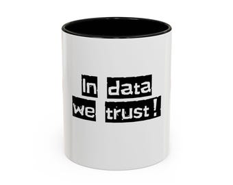 May include: White ceramic mug with a black rim and handle. The mug has black text that reads "In data we trust!" printed on the front.