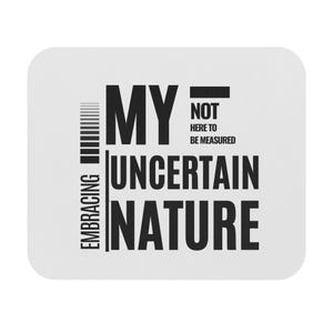 May include: Black and white typography design on a white background. The text reads "Embracing my uncertain nature - not here to be measured".