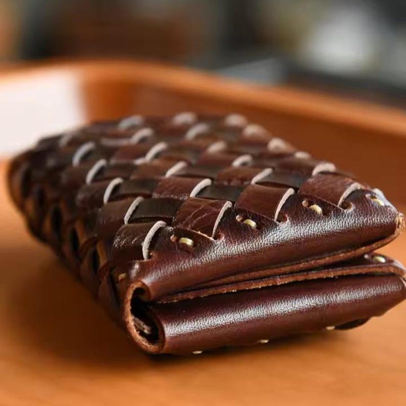 Small genuine leather bifold wallet showing compact size and slim profile