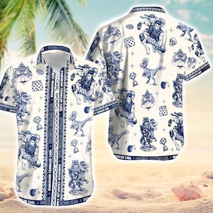 May include: White button-down shirt with a blue and white pattern featuring cartoon characters, dinosaurs, and the text "DUNGEON CRAWLER CARL". The shirt has short sleeves and a collared neckline. The design is repeated on the back.