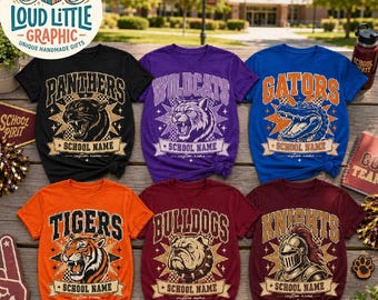 May include: Six short-sleeve t-shirts in black, purple, blue, orange, maroon, and dark red. Each shirt features a graphic with a mascot, a team name, and the text SCHOOL NAME and custom name. Mascots include a panther, wildcat, alligator, tiger, bulldog, and knight.