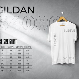 May include: A white Gildan 64000 t-shirt hanging on a wooden hanger. The image includes a size chart with measurements in inches for width, length, and sleeve length. The chart ranges from size S to 4XL.