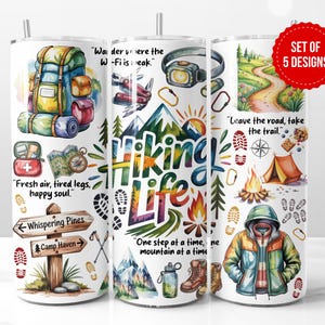 May include: Set of 5 hiking-themed tumblers with colorful illustrations. Designs include a backpack, trail map, compass, campfire, and a hiker in a jacket. Text includes "Hiking Life" and inspirational quotes about the outdoors.