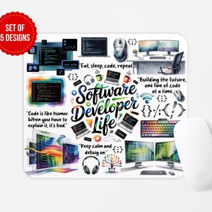 May include: A white mouse mat with a colourful design featuring the words "Software Developer Life" and coding-related graphics. The mat includes text such as "Eat, sleep, code, repeat" and "Keep calm and debug on."