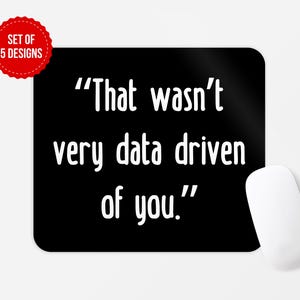 May include: Black mouse pad with white text that reads "That wasn't very data driven of you."