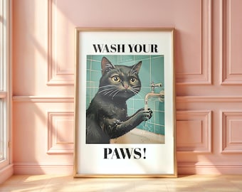 May include: Framed art print featuring a black cat washing its paws at a faucet. The cat is in a bathtub with a teal tiled wall. The words "WASH YOUR PAWS!" are printed above and below the cat image.