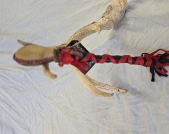 Horse/deer rawhide rattle.