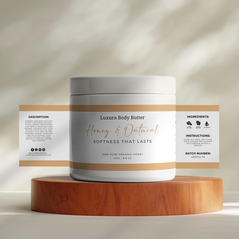 May include: White jar of Luxura Body Butter Honey & Oatmeal, a 100% pure organic honey product. The jar is labeled with the product name, ingredients, instructions, and batch number. The jar is sitting on a wooden surface.