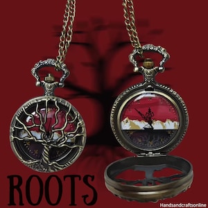 May include: Two antique-style pocket watches with bronze-colored chains. One watch features a tree design, the other a landscape scene. The word "ROOTS" is printed in white at the bottom. The watches have red and gold accents.