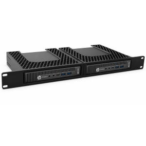 May include: A black metal rack mount kit holding two HP EliteDesk mini computers. The mount features a honeycomb-patterned top ventilation grill and a front panel with mounting ears. Each computer displays the HP logo and EliteDesk text.