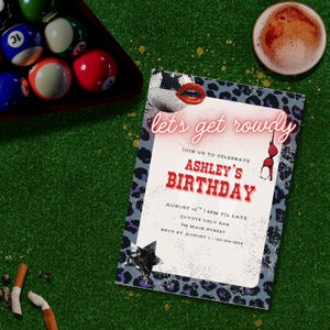 May include: A party invitation with the text "Let's get rowdy" and "Ashley's Birthday" on a green surface. The invitation has a leopard print border and a disco ball and lips graphic. Pool balls and a beer are also visible.