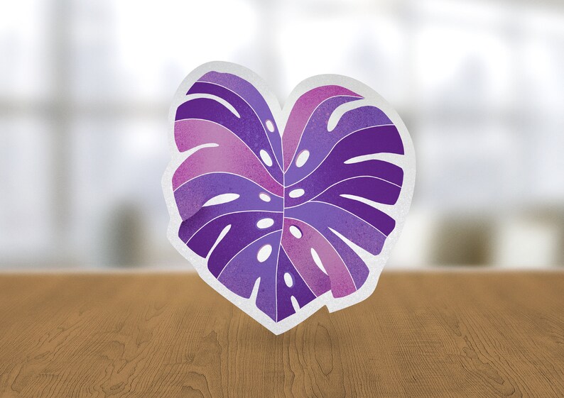 May include: A purple and pink monstera leaf sticker with a white outline. The sticker is in the shape of a heart.
